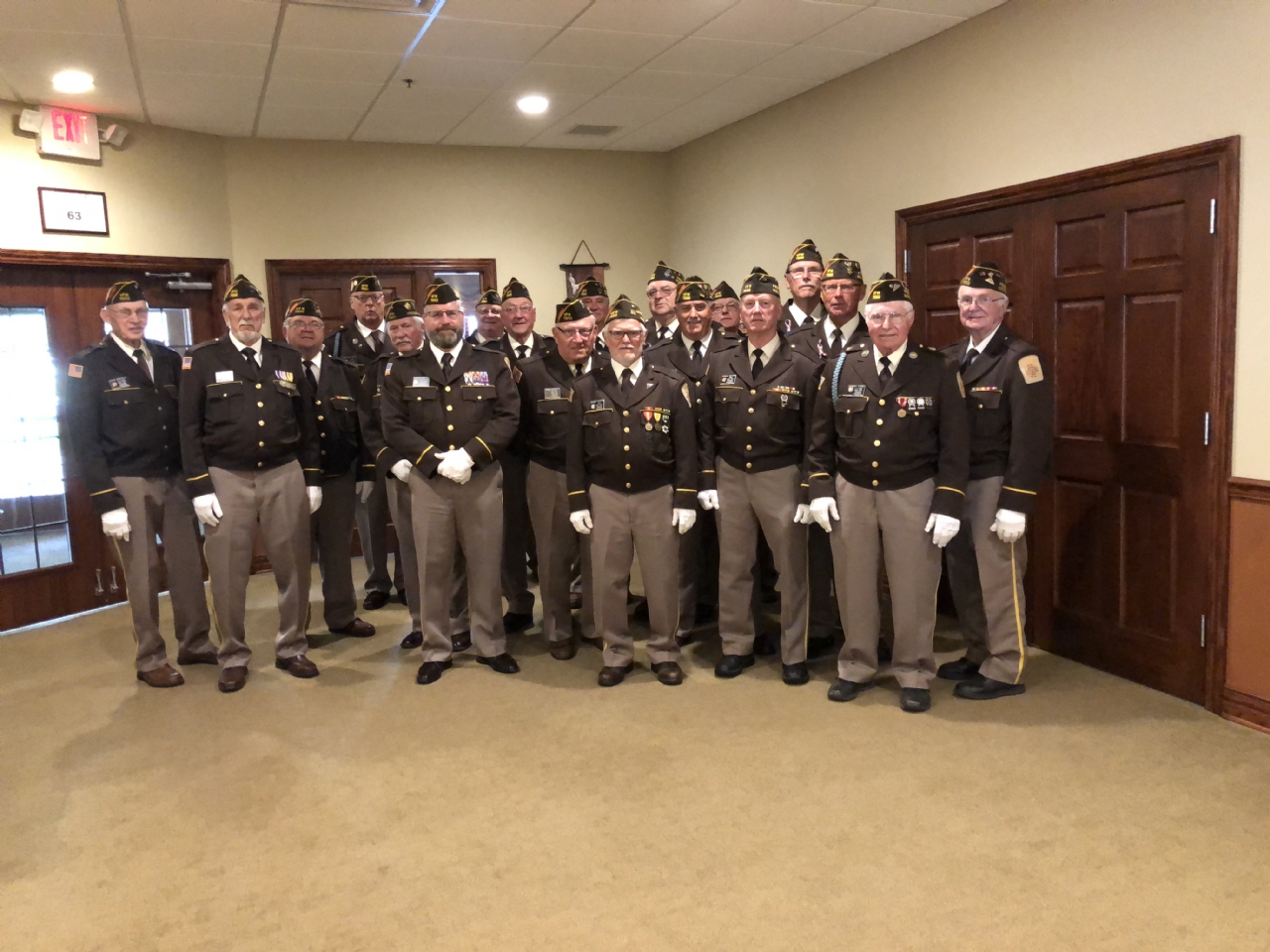 Members of VFW 7692 have  dressed in their dress uniform , to show respect for a fallen comrade , during a military funeral.
